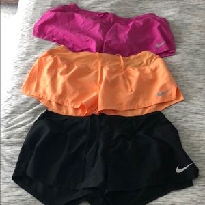 (3) Nike running shorts